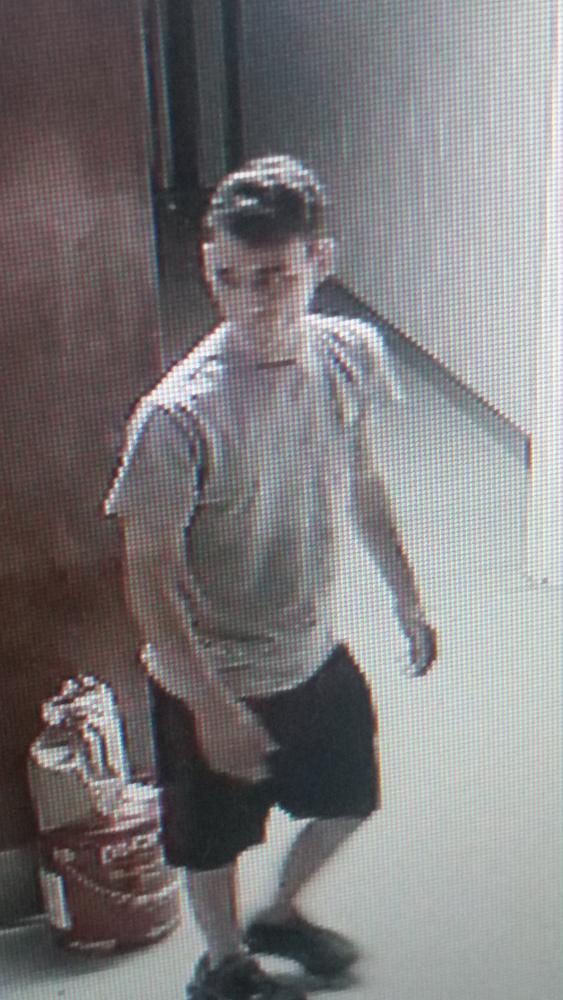 One of the suspects facing towards the security camera.